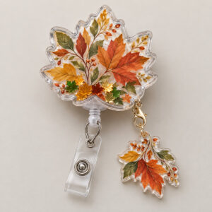 Falling Leaves Shaker Badge Reel with autumn leaves drifting in rust, gold and green