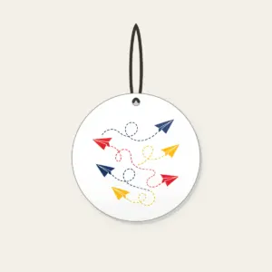 Paper Planes and Dotted Flight Paths Ceramic Ornament in white: Paper planes trace dotted flight paths across cream in navy, red and yellow.