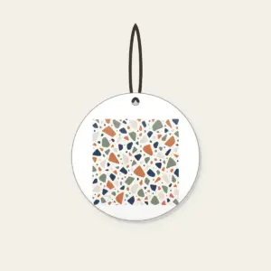 Chip Terrazzo in Terracotta and Navy Ceramic Ornament in white: An all-over terrazzo of chips in terracotta, sage, navy and cream on a warm white field.