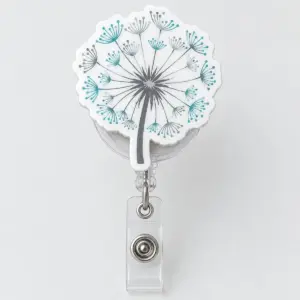 Dandelion Wish Badge Reel with a dandelion seed head with seeds drifting away in grey and teal on white