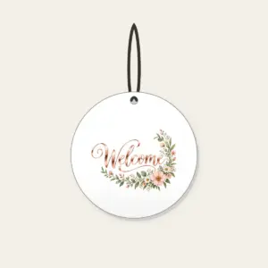 Rose Gold Welcome Wildflower Garland Ceramic Ornament in white: The word “Welcome” in rose gold mirror lettering, with a blush and sage wildflower garland curling into one corner.