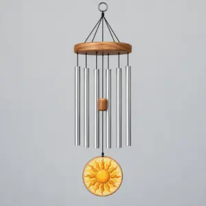 Sunbeam Suncatcher Wind Chime with round pane with a sunburst in amber and gold with small hanging pieces in a similar palette