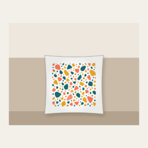 Coral, Teal and Mustard Terrazzo Pebbles Pillow in white: All-over terrazzo pebbles in coral, teal and mustard on a cream ground with clear breathing room.